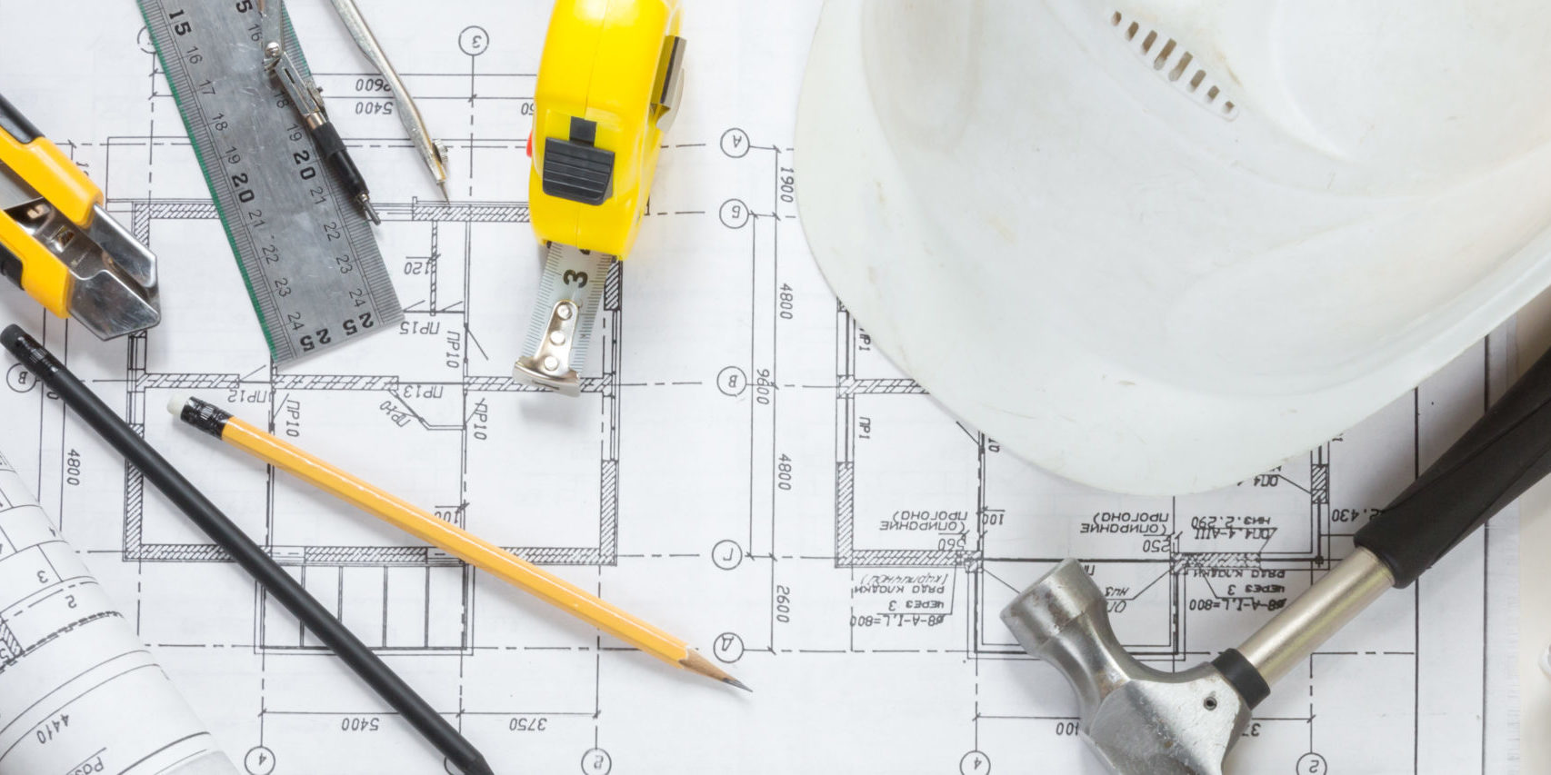 architect design working drawing sketch plans blueprints and making architectural construction model in architect studio,flat lay long banner.
